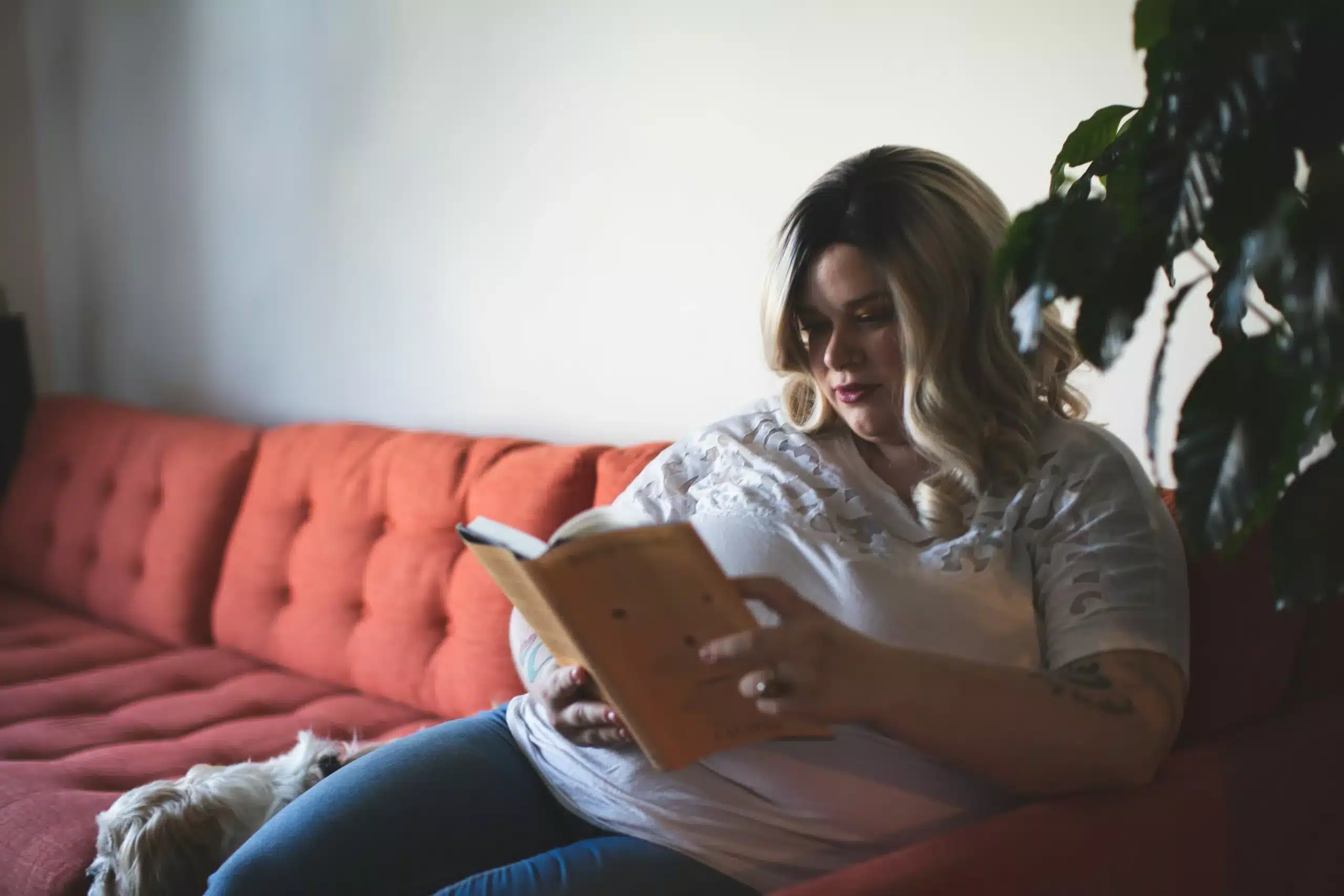 Woman on the autism spectrum reading a book written by an autistic author.