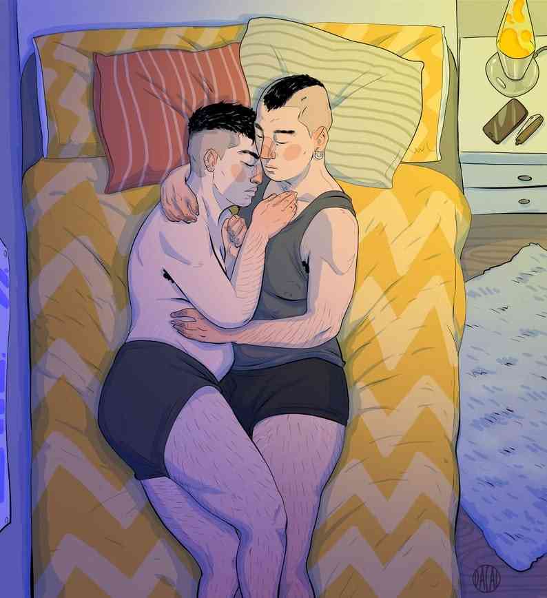 A butch lesbian couple with curvy figures and short hair embrace in bed.