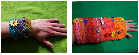 Sensory cuffs knitted with buttons and beads.
