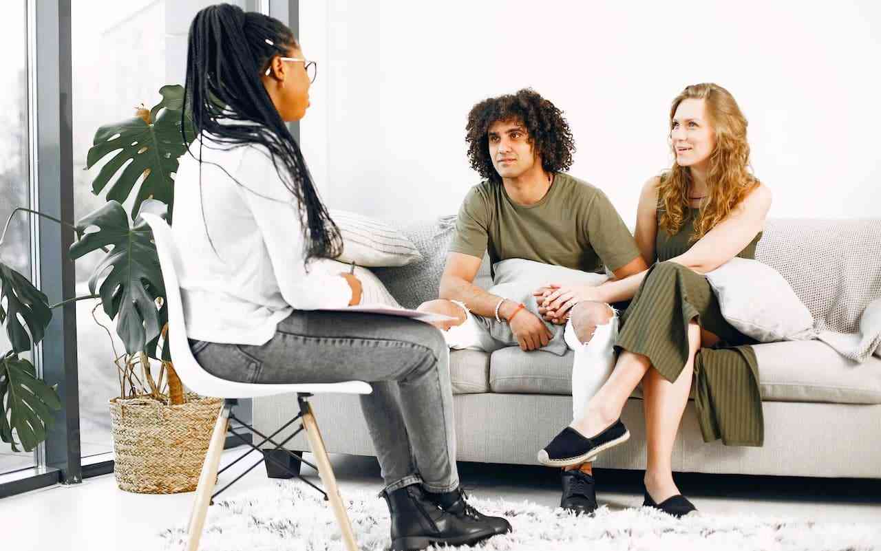 Couples therapy session. Man and woman meeting with marriage and family therapist.