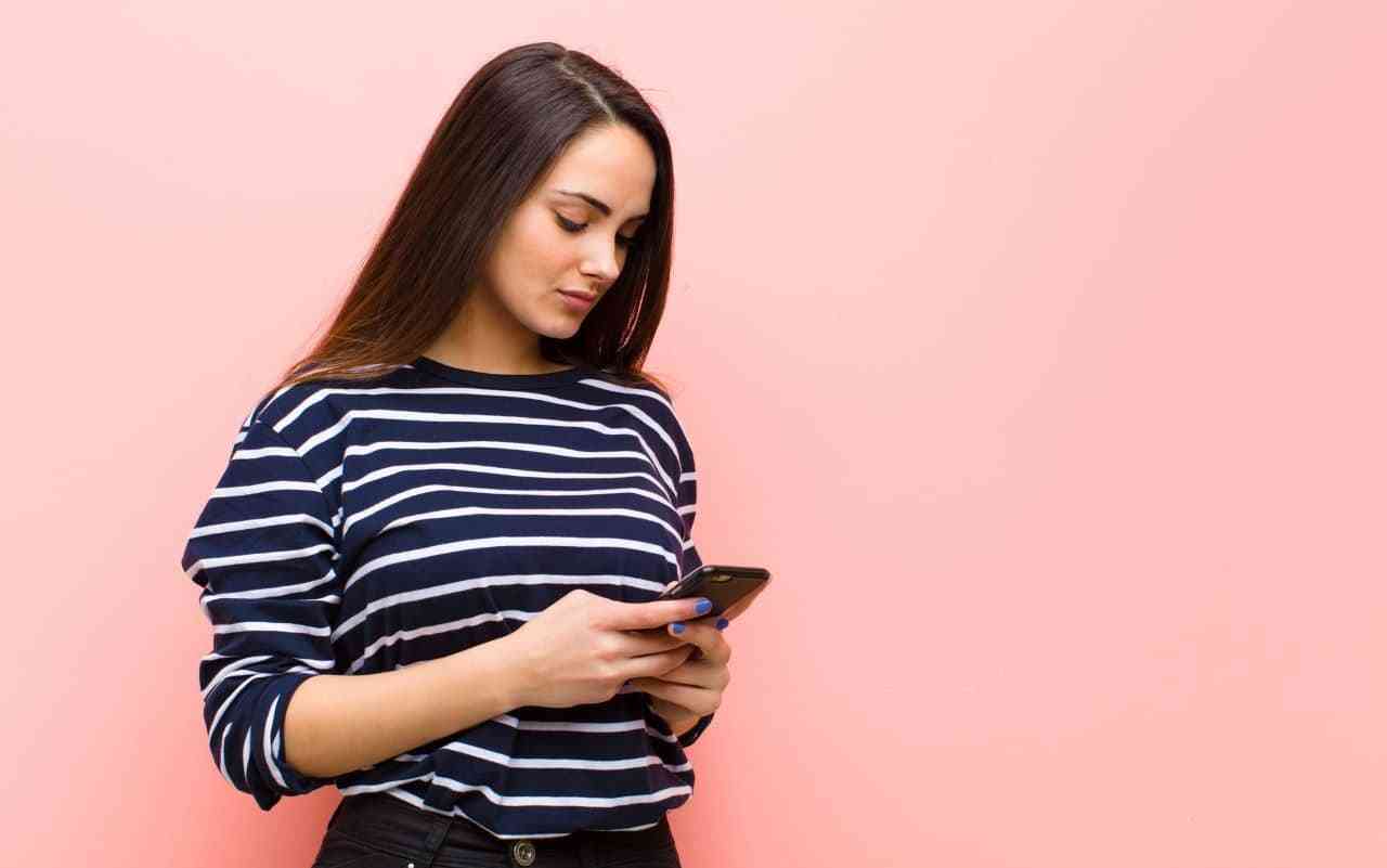 Woman video journaling on her smartphone.