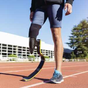 Amputee using a carbon fiber blade leg prosthesis for running.