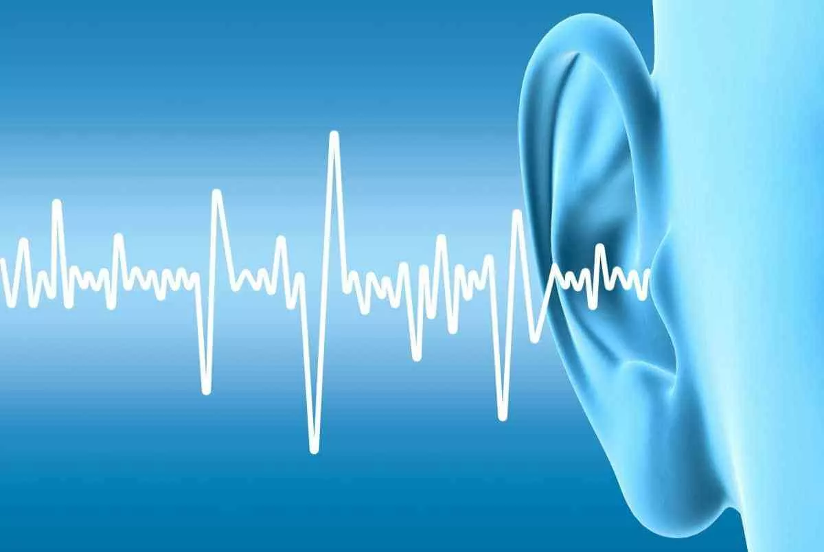 Tinnitus treatment and relief. Image of human ear with sound waves.