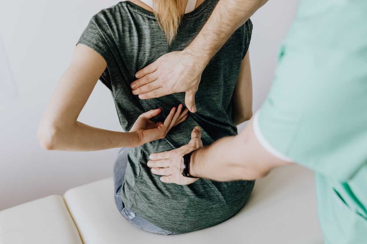 Woman at chiropractor after a car accident.