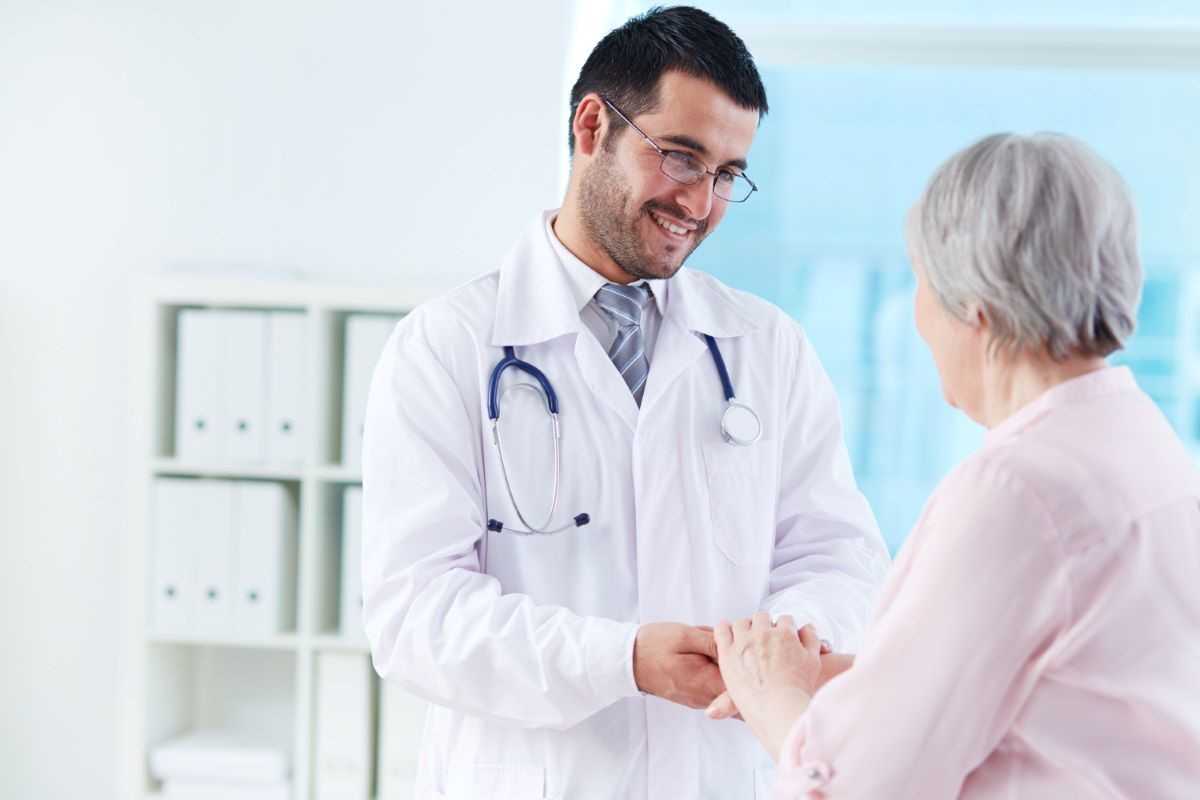 Doctor and patient at a personalized primary care clinic.