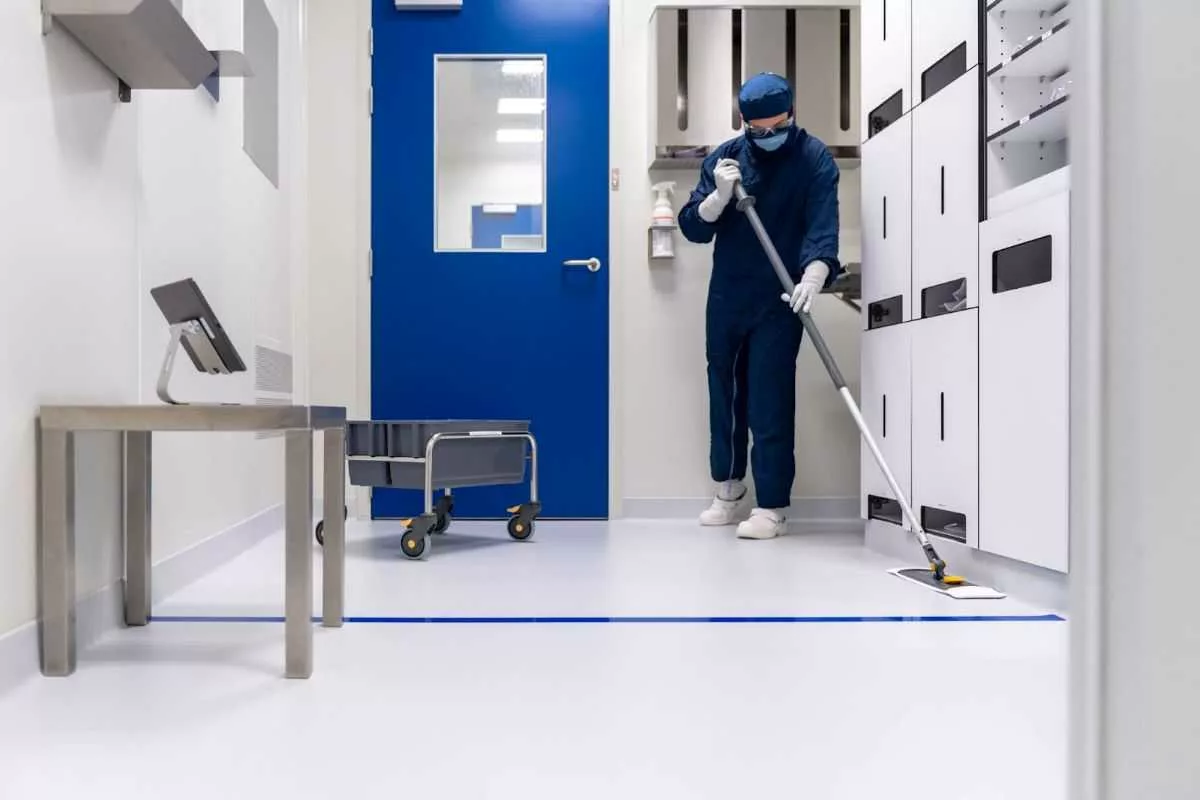 Man cleaning sterile area.