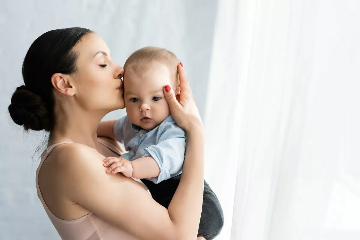 Mother in recovery holding her child.