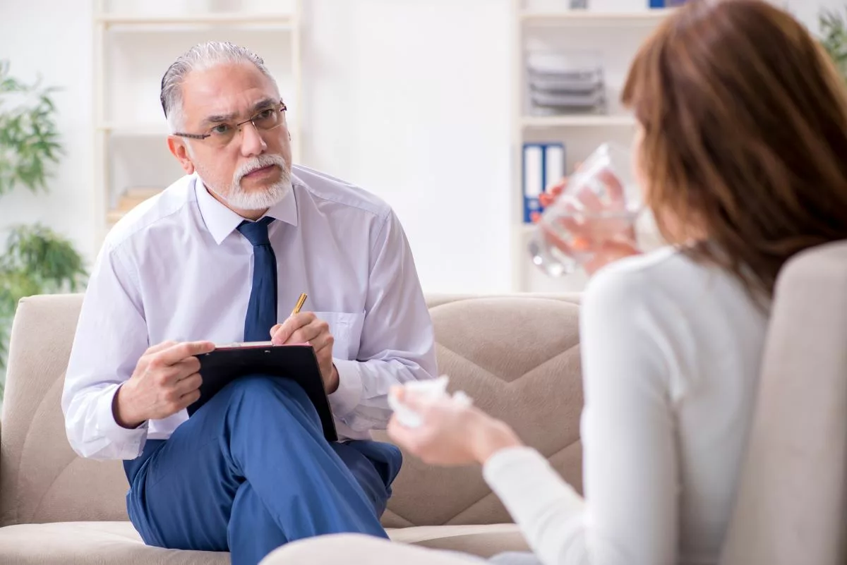 Psychiatrist evaluating a patient.