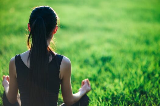 Woman doing yoga to cope with detox.