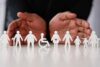 Disability inclusion: paper cutouts representing disabled people of different ages and body types including a wheelchair.