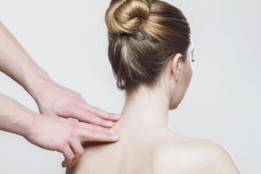 Woman with multiple sclerosis receiving physiotherapy.