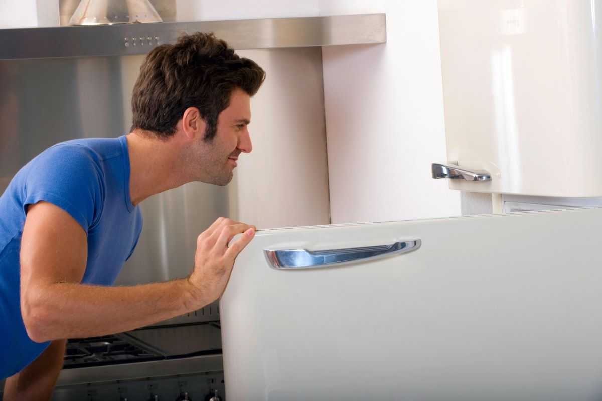 Man placing testosterone in the refrigerator.