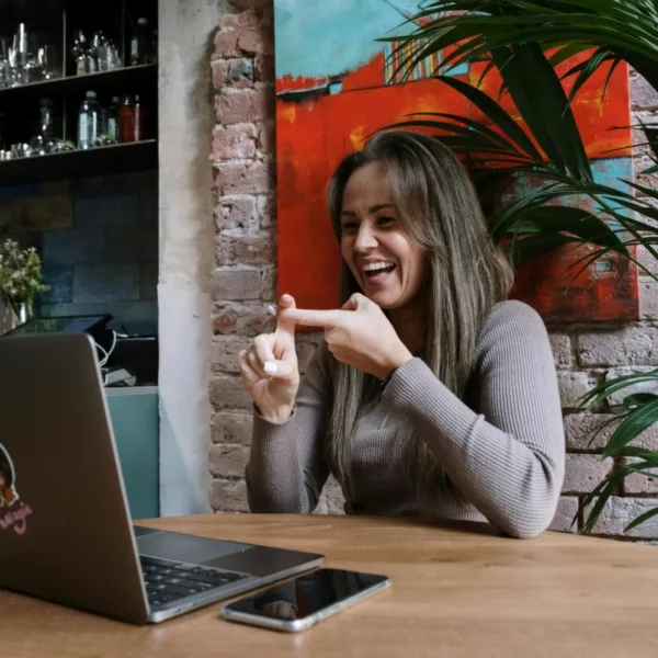 Deaf woman video chatting with friends.