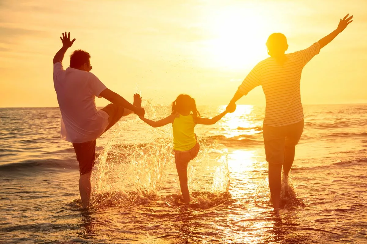 Parents and child enjoying a beach holiday