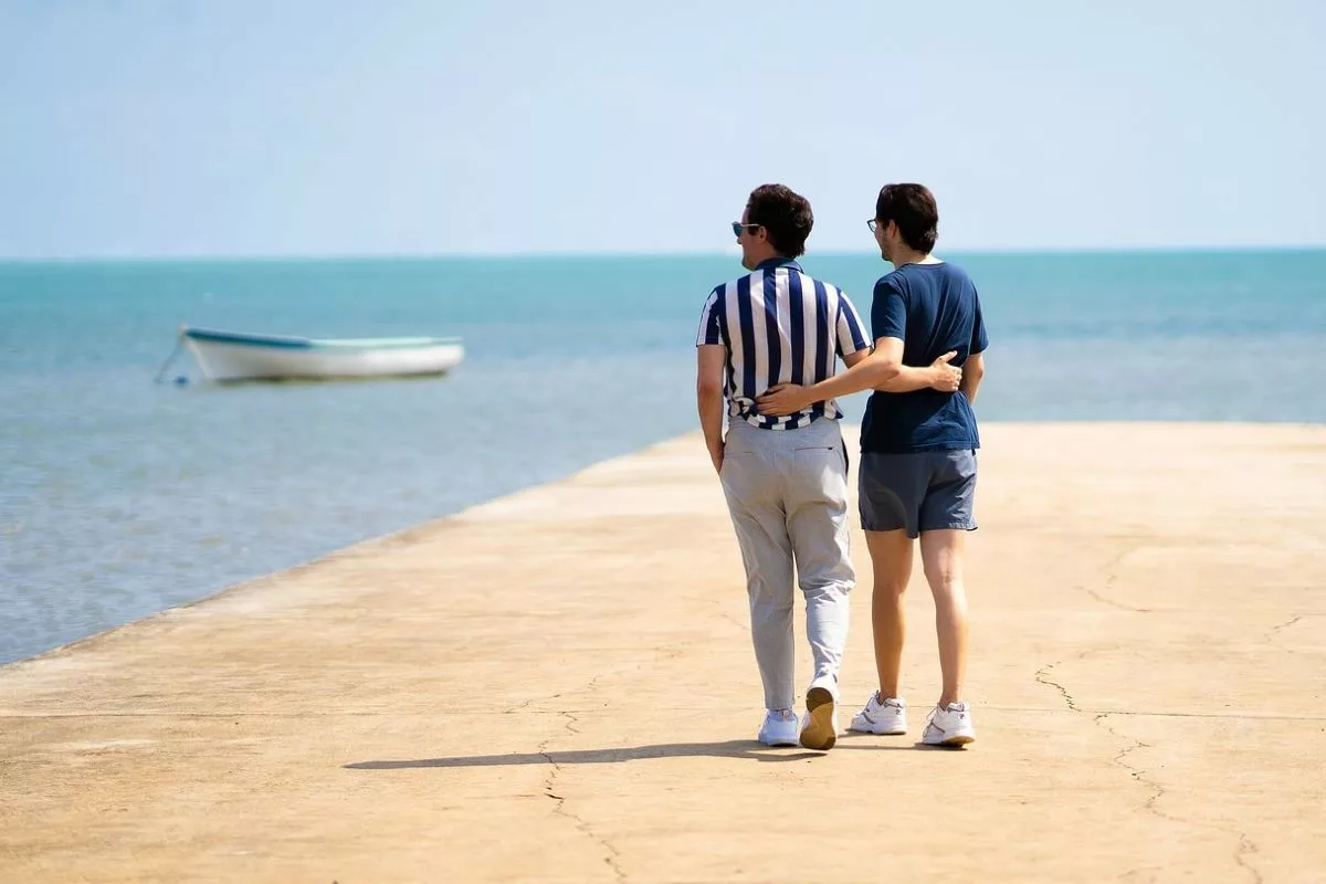 Couple walking on the beach.