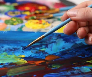 Person creating abstract painting