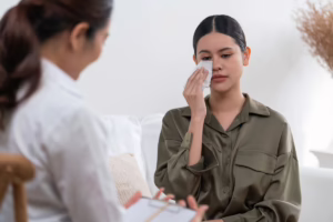 Crying woman with therapist.