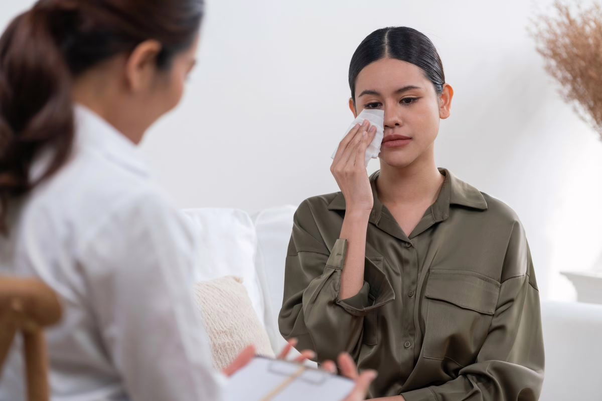 Crying woman with therapist.
