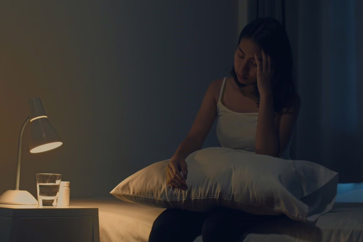 Woman struggling with insomnia.