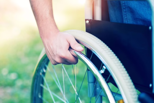 Man pushing his wheelchair.