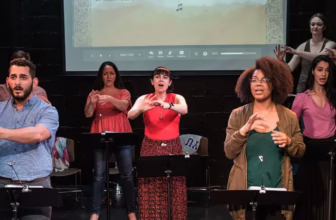 The Deaf and hearing cast of the musical "Stepchild" perform at IRT Theater. The musical combines singing, music and American Sign Language.