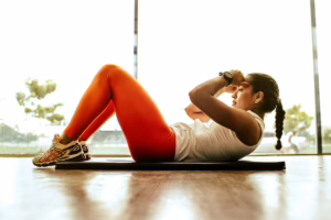Woman exercising on a mat.