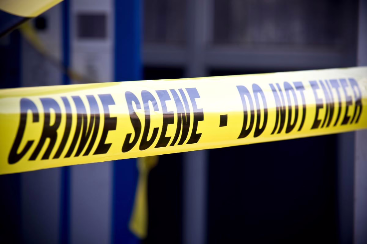 Surviving a home invasion robbery as a person with a disability. Crime scene tape outside a building.
