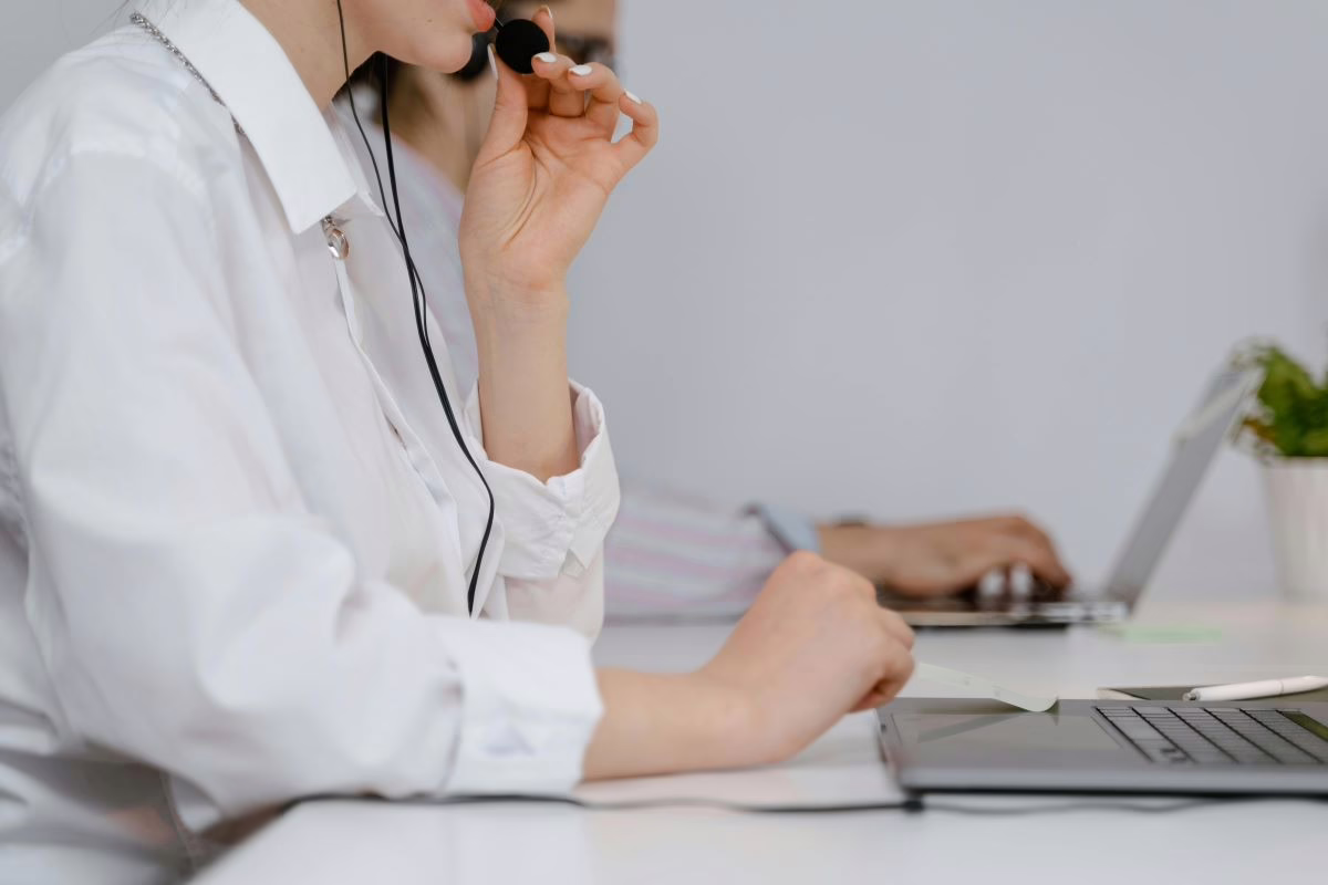 Speech-language pathologist listening on earphones.