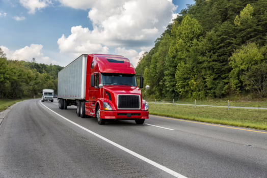 Red semi truck on the freeway