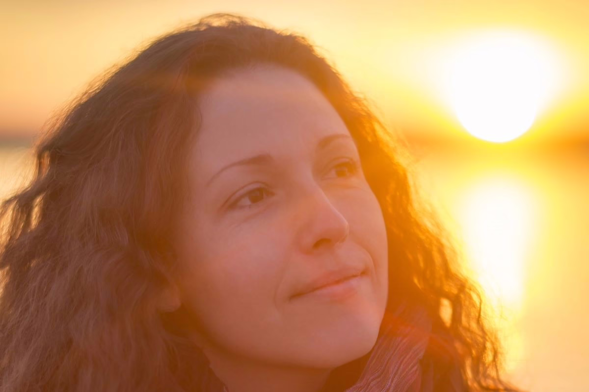 Woman thinking at sunset.
