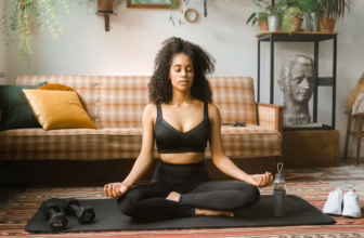 Woman meditating in a schizophrenia supportive living home.