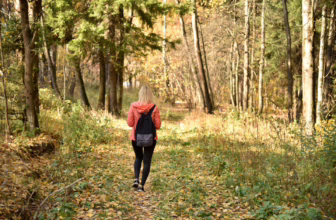 Woman walking in the forest.