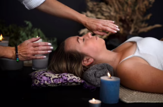 Woman receiving reiki treatment.