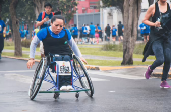 Wheelchair racer in track uniform.
