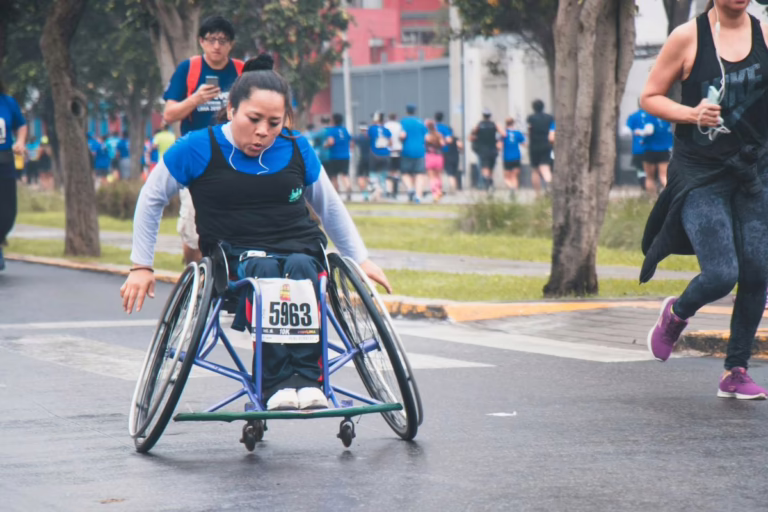 Wheelchair racer in track uniform.