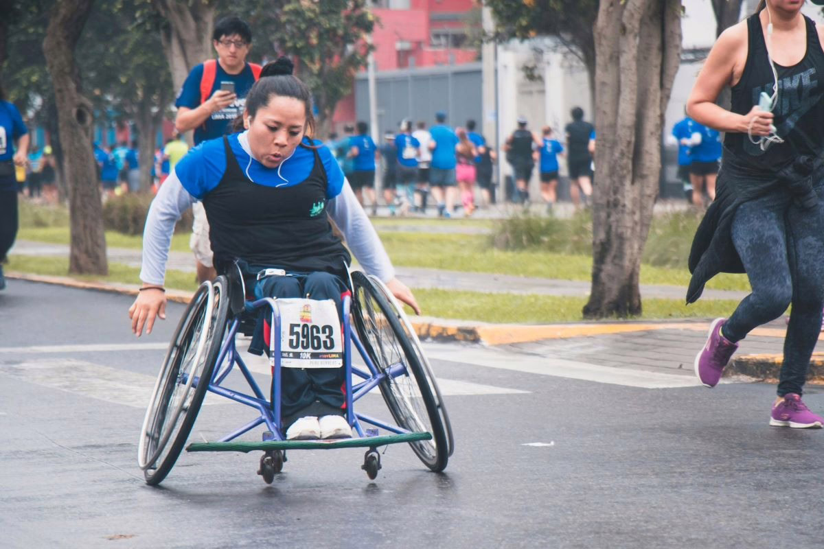 Wheelchair racer in track uniform.