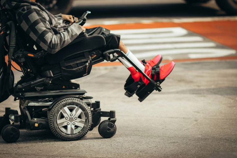 Man using power wheelchair.