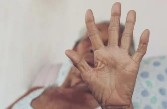 Senior woman pushing away abuser.