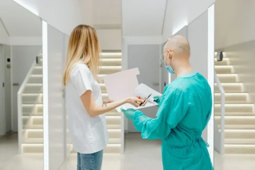 Doctor and patient looking at file.