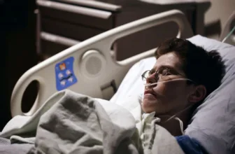 Man in hospital bed.