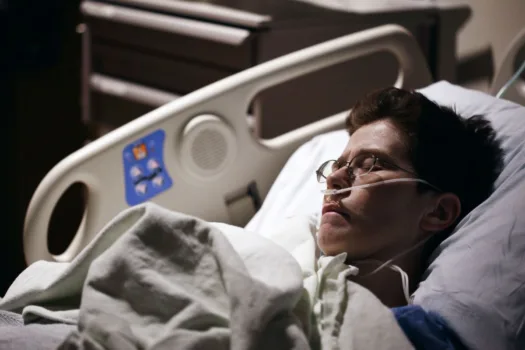 Man in hospital bed.