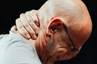 Man experiencing neck pain.