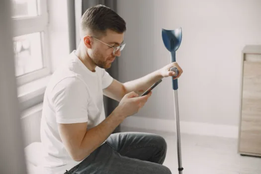 Man with a forearm crutch.