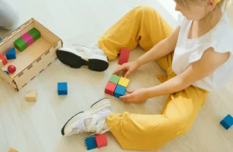 Autistic child playing with blocks.