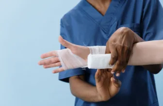 Nurse bandaging a burn injury.
