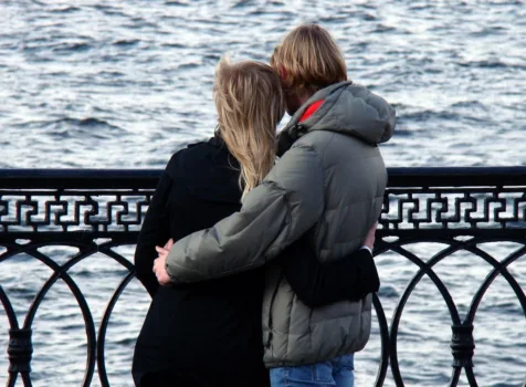 Couple looking out at the ocean.
