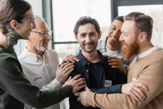 Group of people in recovery supporting each other.