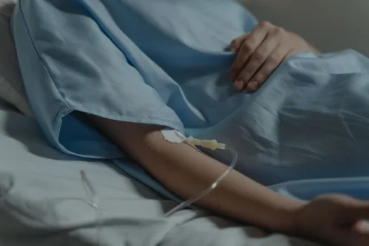 Woman receiving IV therapy.