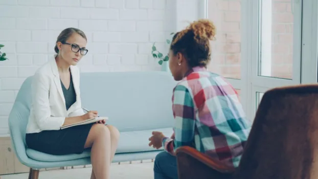 Woman talking to therapist.